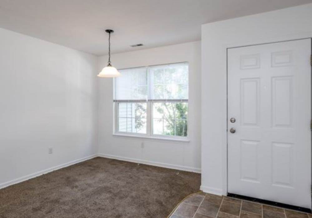 Spacious interior living area at Heritage Park Apartments & Townhomes in Webster, New York