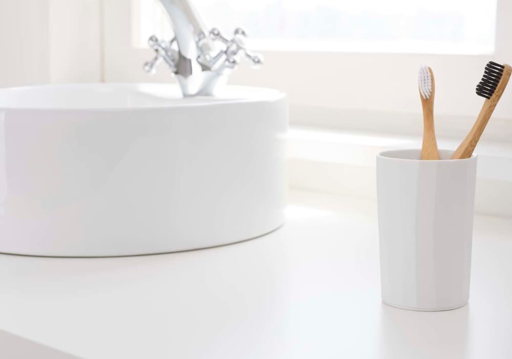 Bathroom sink with countertop basin and essentials at North Road Townhomes in Scottsville, New York