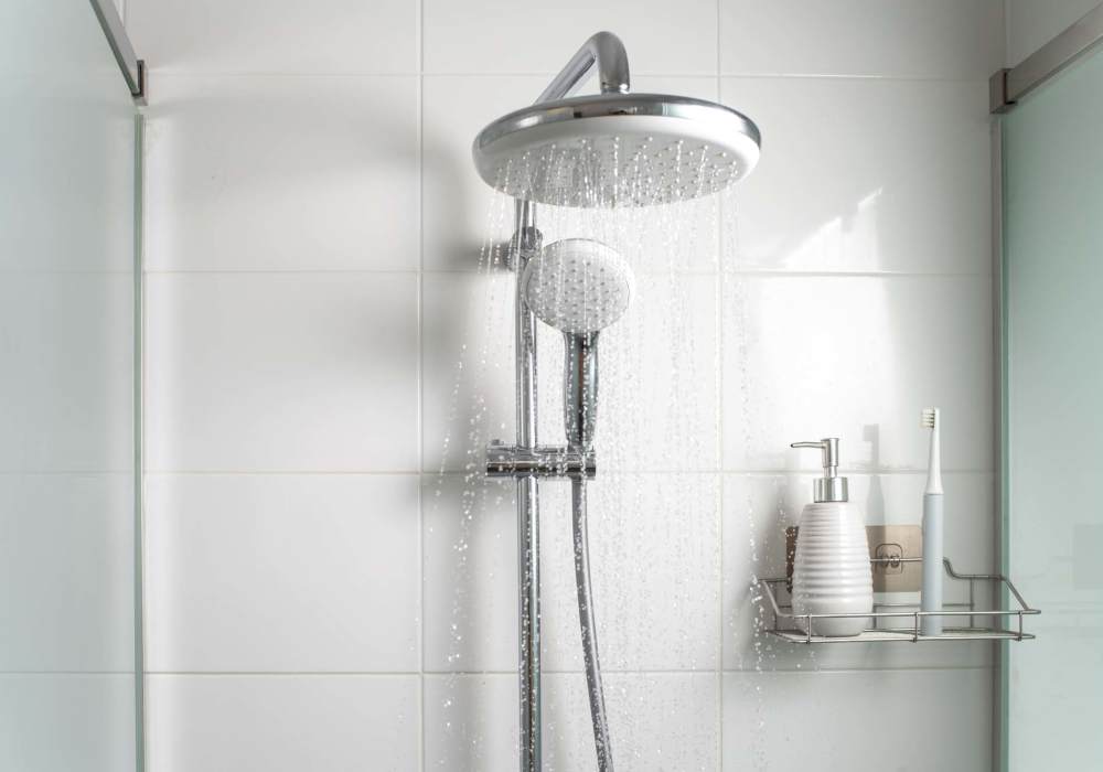 Modern shower with glass enclosure and fixtures at North Road Townhomes in Scottsville, New York