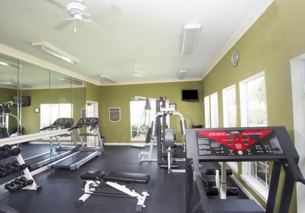 Fitness center with cardio machines at Reata Apartments in Harlingen, Texas