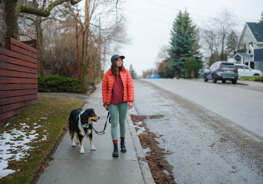 Resident walking with pet dog at Reata Apartments in Harlingen, Texas