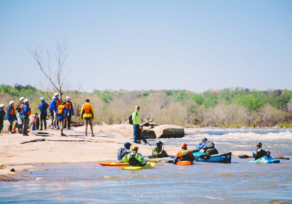 People enjoying boating in river near City View Lofts in Richmond, Virginia