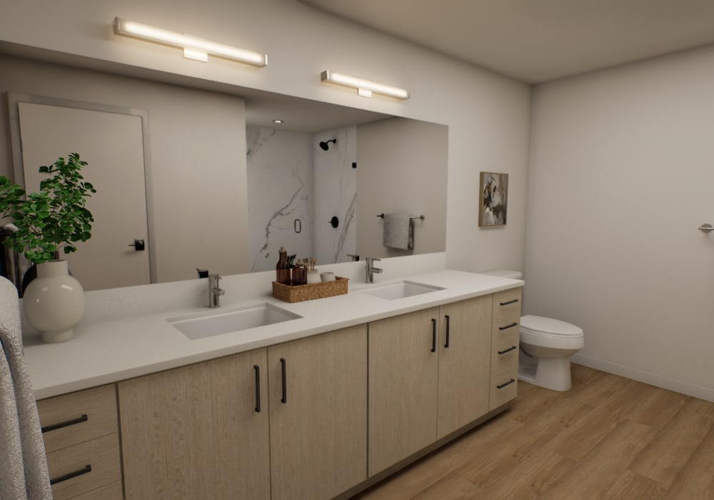 Modern double vanity with wood cabinetry at The Colton in Redwood City, California
