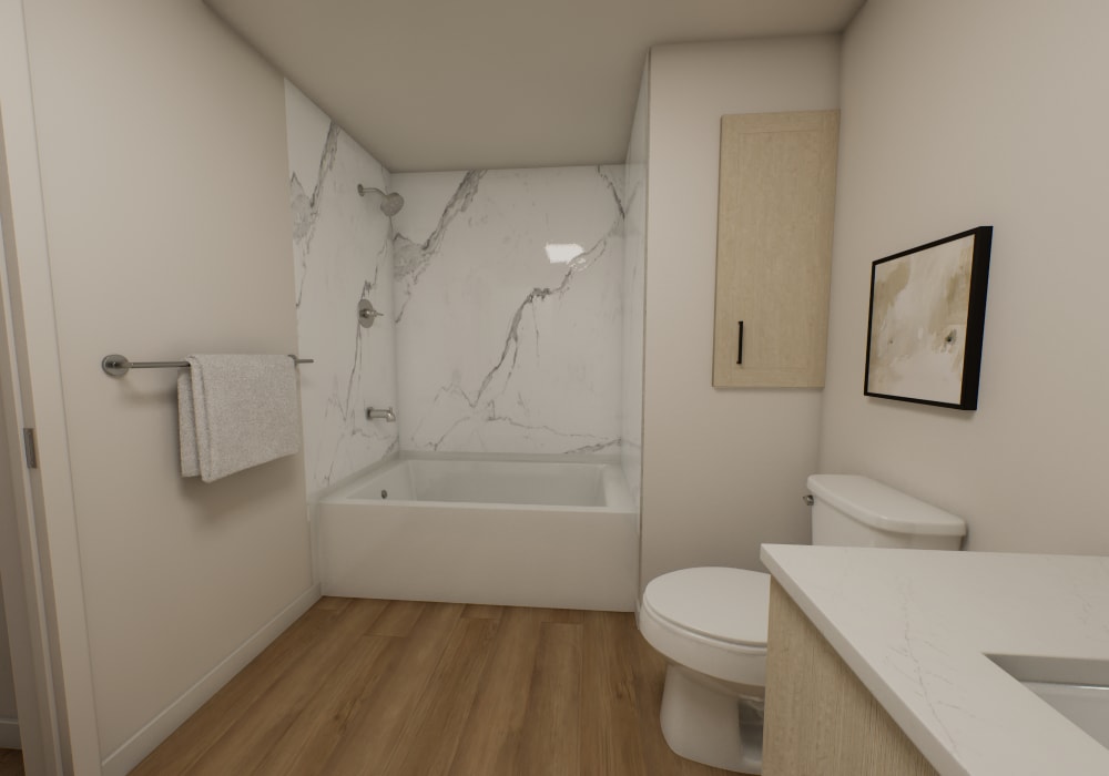 Modern bathroom with tub and marble accents at The Colton in Redwood City, California