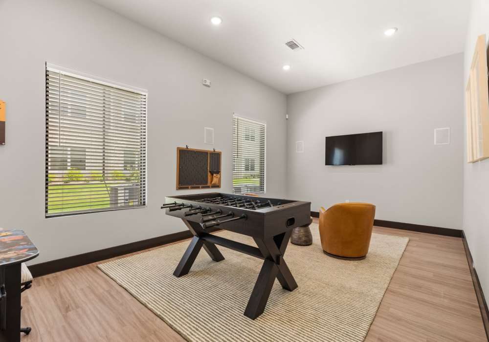 Resident lounge with foosball table at Walnut Springs in Seguin, Texas