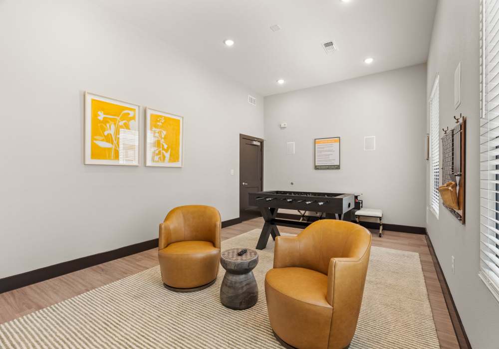 Resident lounge with foosball table at Walnut Springs in Seguin, Texas
