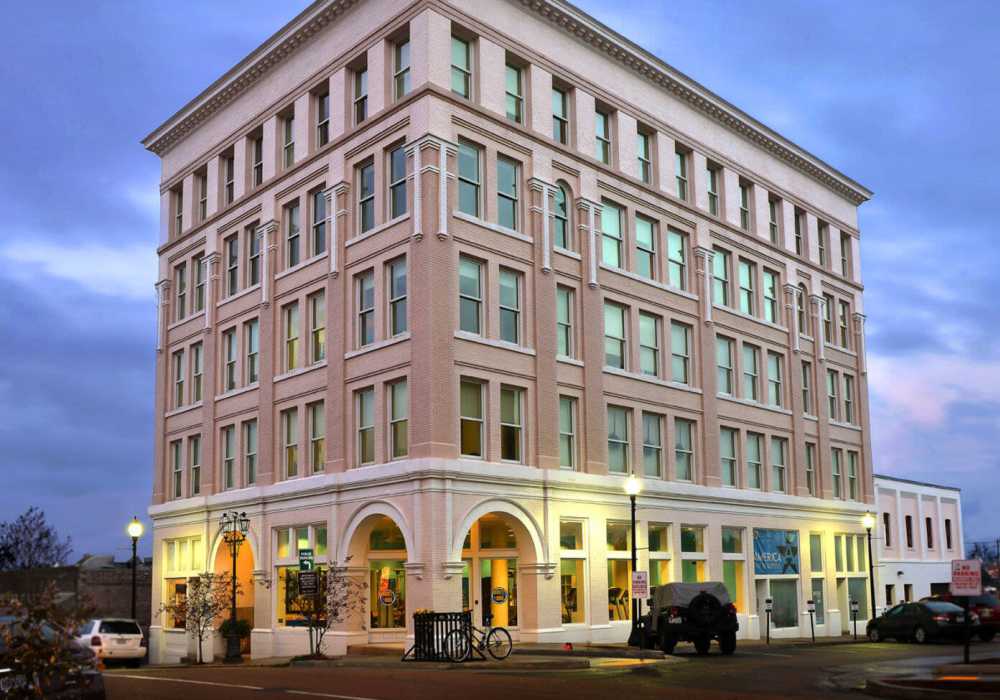 Brick building with large windows at Hub City Lofts in Hattiesburg, Mississippi