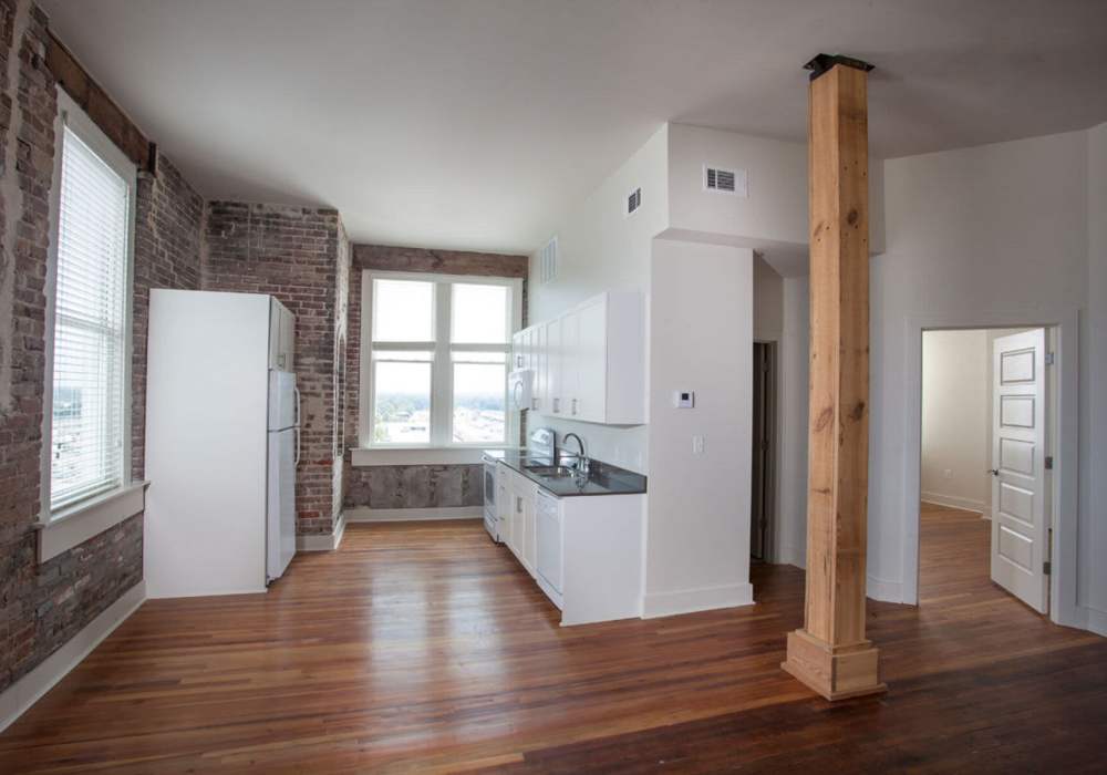 Bright windows illuminate the kitchen area at Hub City Lofts in Hattiesburg, Mississippi
