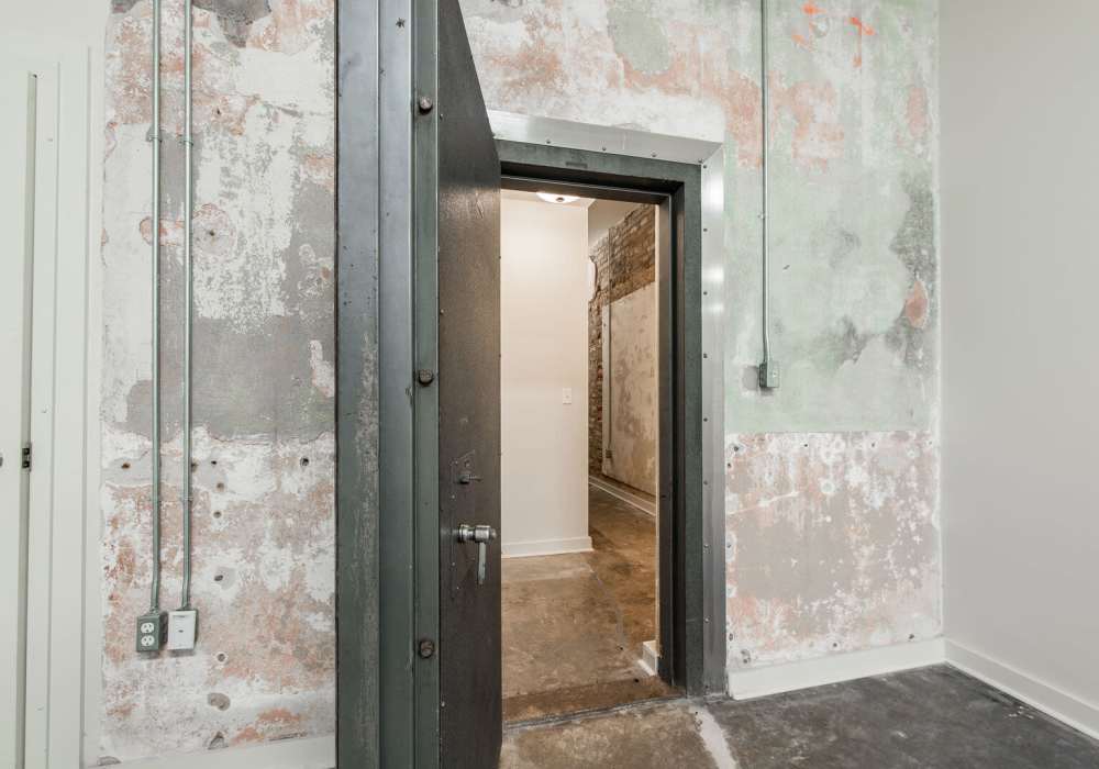 Metal door with exposed brick wall at Hub City Lofts in Hattiesburg, Mississippi
