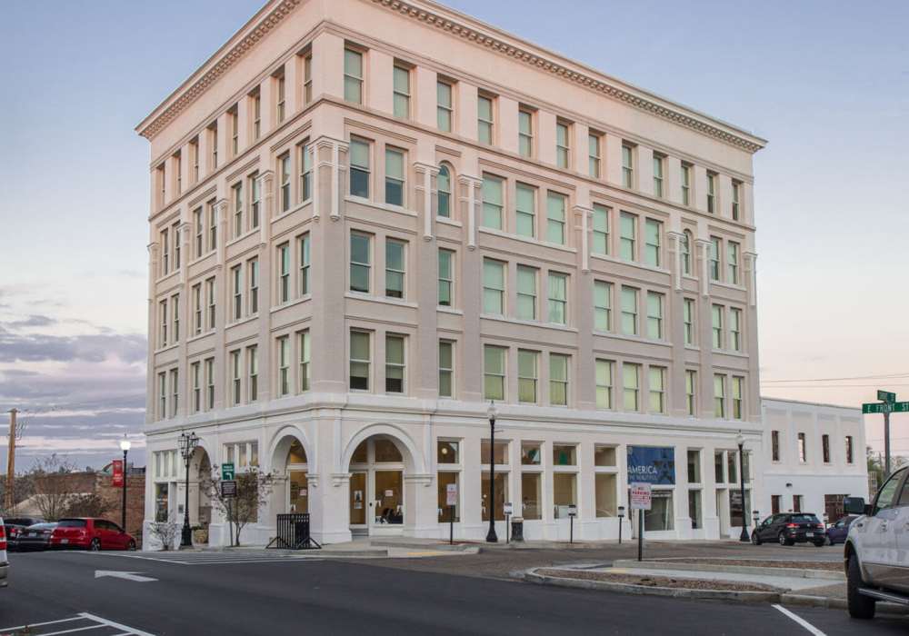 Five-story building with large windows at Hub City Lofts in Hattiesburg, Mississippi