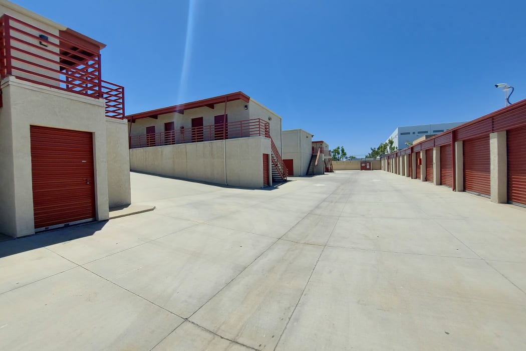 outdoor units with red doors on a sunny day at Gilbert Self Storage in Fullerton, California