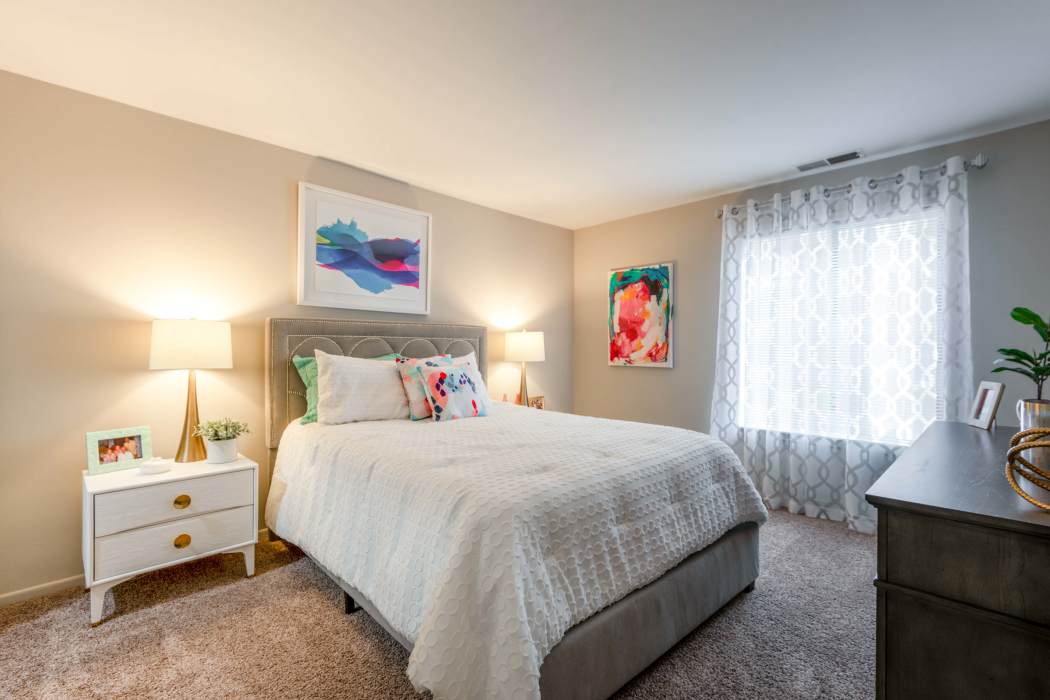 Simple yet cozy bedroom at The Timbers at Long Reach Apartments in Columbia, Maryland