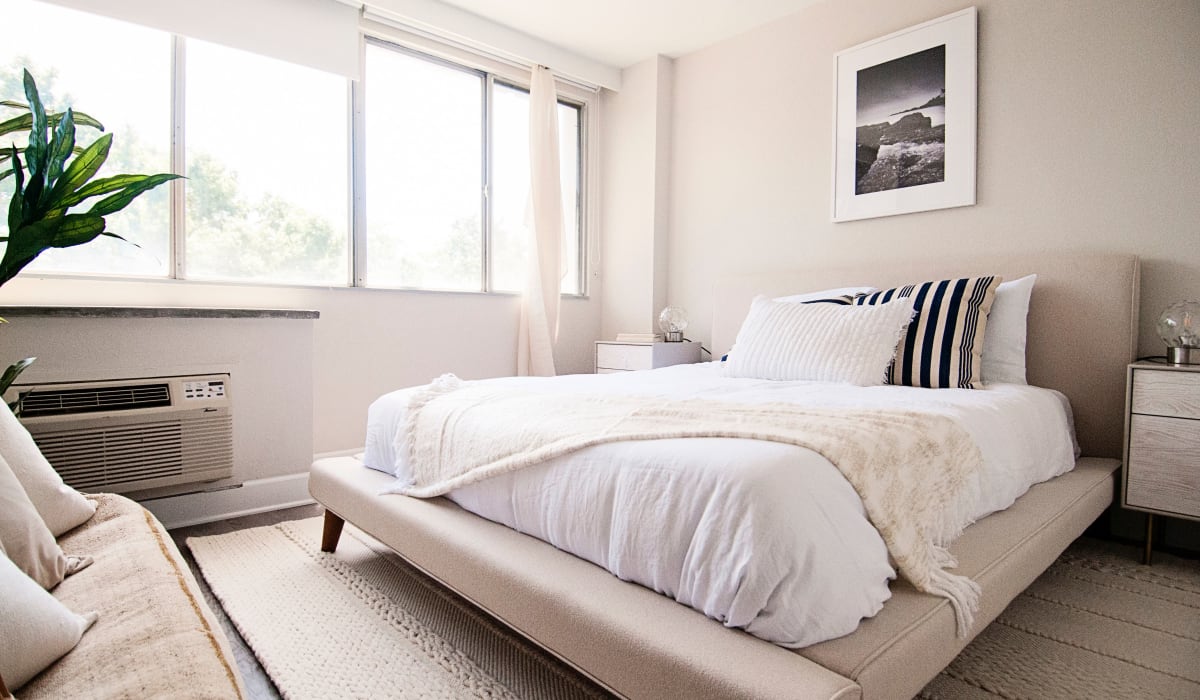 Spacious master bedroom with large windows and plenty of natural light in model home at The Wayland in St Petersburg, Florida