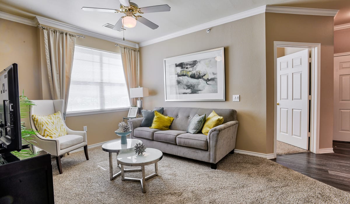 Spacious and well lit living room at Bella Springs Apartments in Colorado Springs, Colorado