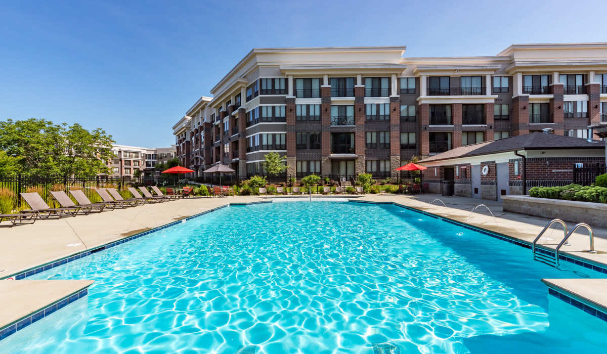 Beautiful pool with poolside seating areas at Latitude at Deerfield Crossing in Mason, Ohio