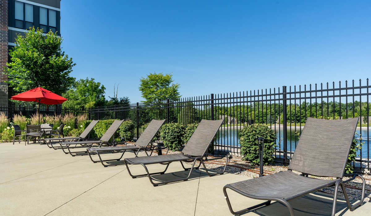 Poolside lounge chairs at Latitude at Deerfield Crossing in Mason, Ohio