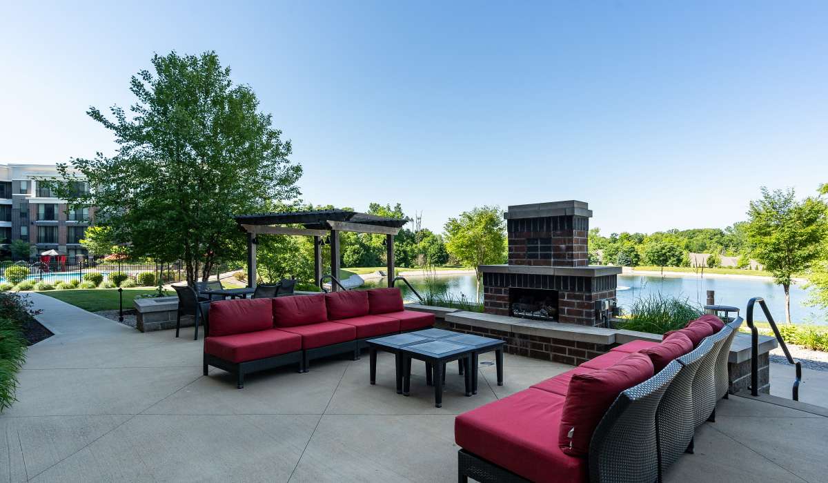 Outdoor lounge area with fireplace at Latitude at Deerfield Crossing in Mason, Ohio