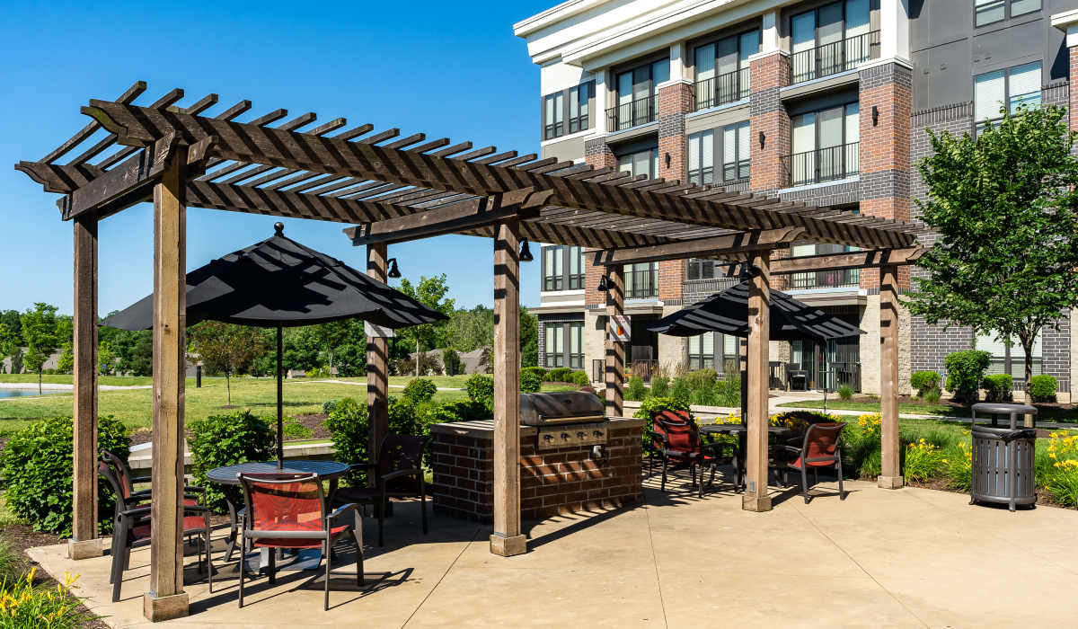 Grilling station with seating area at Latitude at Deerfield Crossing in Mason, Ohio