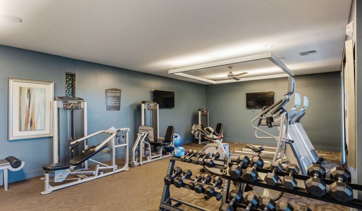 Fitness center with exercise equipment at Latitude at Deerfield Crossing in Mason, Ohio