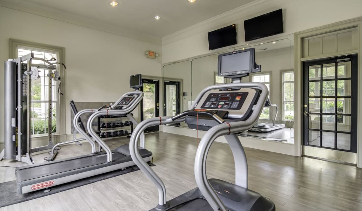 Fitness center with cardio machines at Evergreen Commons in Union City, Georgia