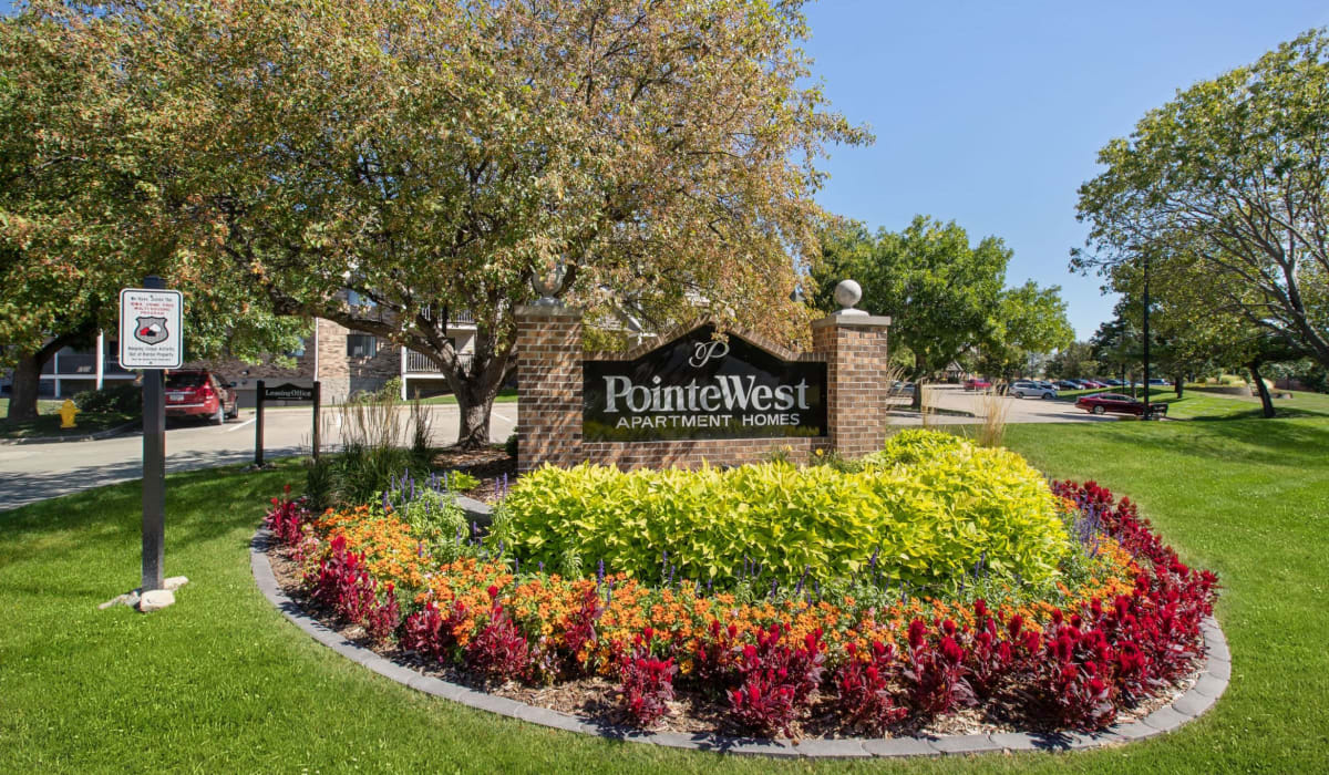 Pointe West sign near the driveway at Pointe West Apartment Homes in West Des Moines, Iowa