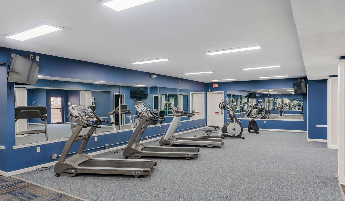 Fitness center with treadmills, elliptical, and large mirrors at Burlington Oaks in Burlington, Kentucky