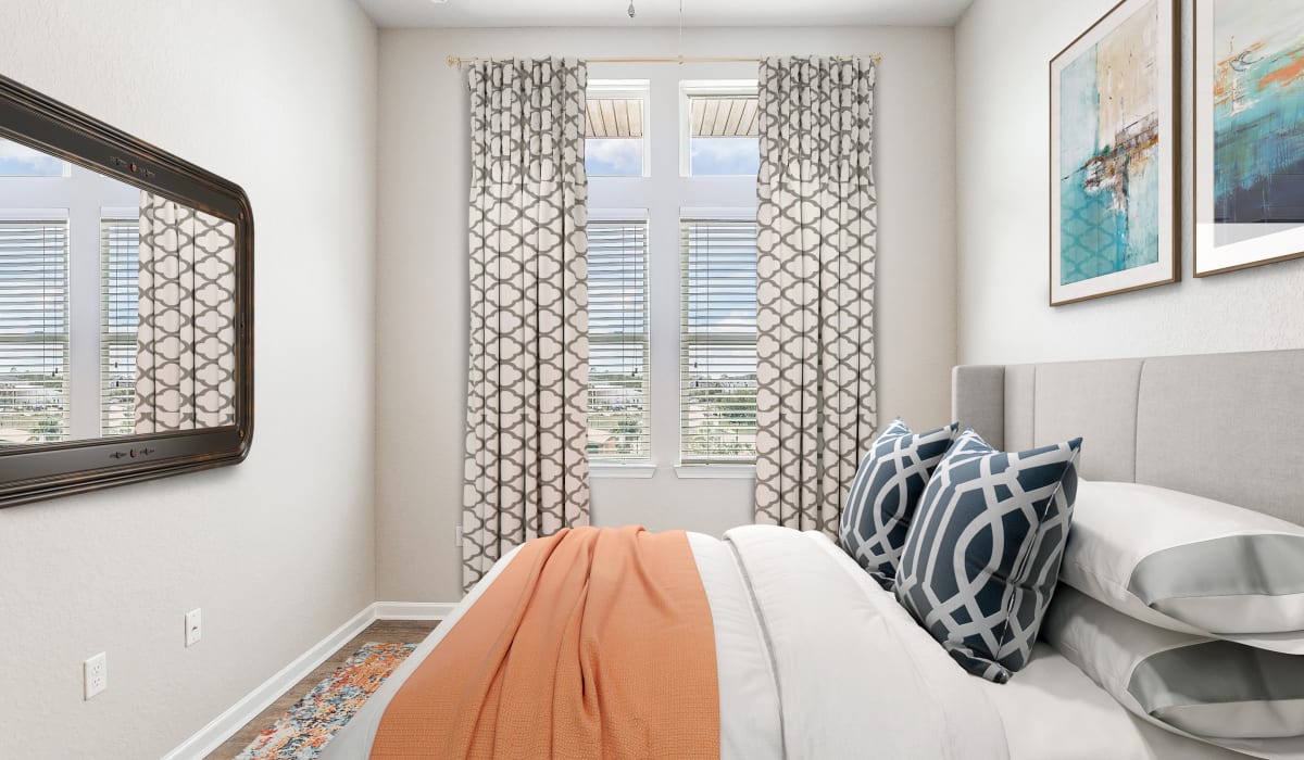 Spacious bedroom with large window at Art Avenue Apartment Homes in Orlando, Florida