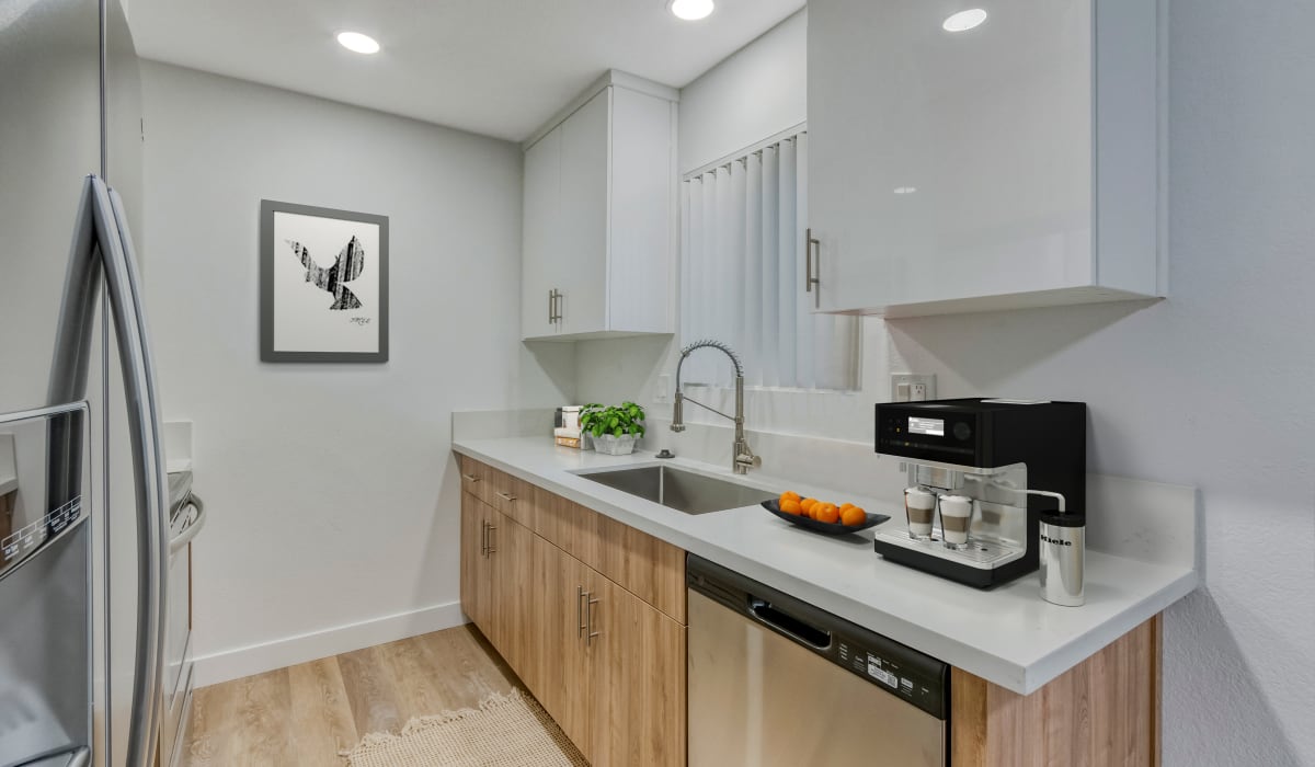 Beautiful kitchen amenities with modern appliances at The Arbors at Magnolia in Anaheim, California