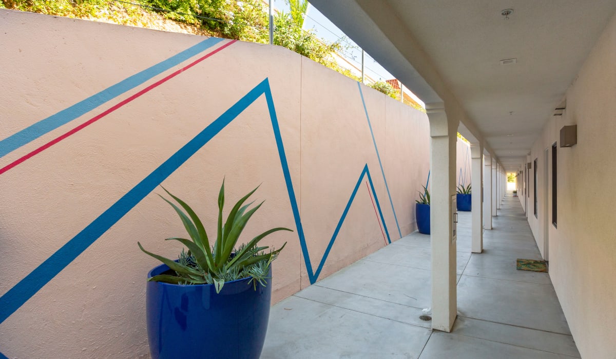 Colorful wall next to resident pathway at Mission West Lofts in San Diego, California