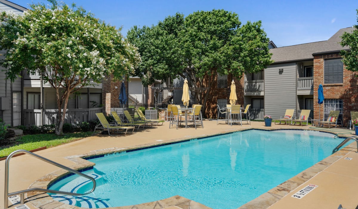 outdoor pool with trees at Crossroads at Arlington in Arlington, Texas