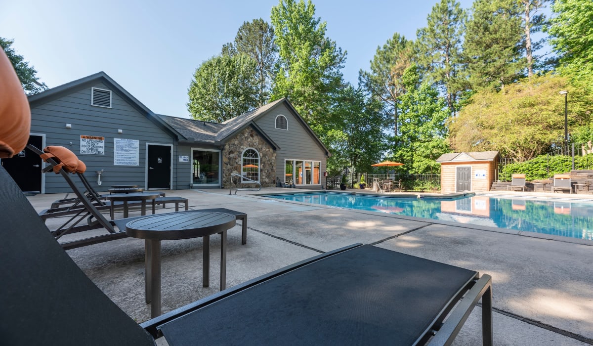 Pool with lounge chairs at Reserve at Garden Lake in Riverdale, Georgia