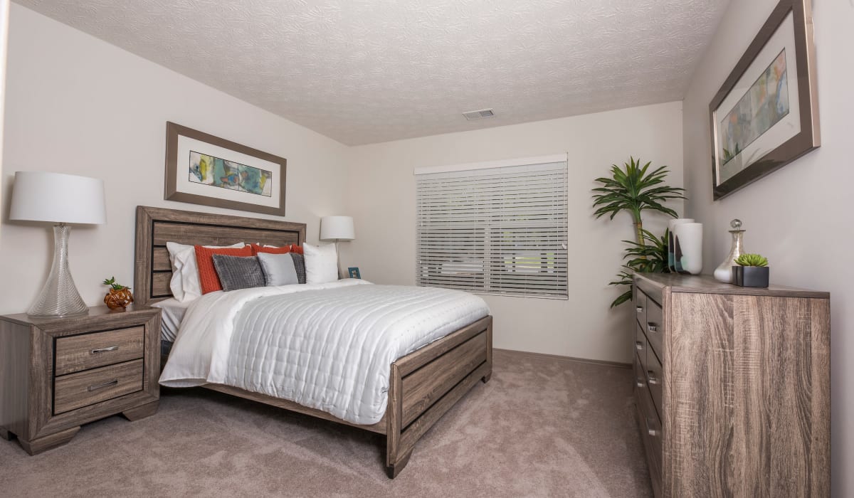 Bedroom with cozy bed at Reserve at Garden Lake in Riverdale, Georgia