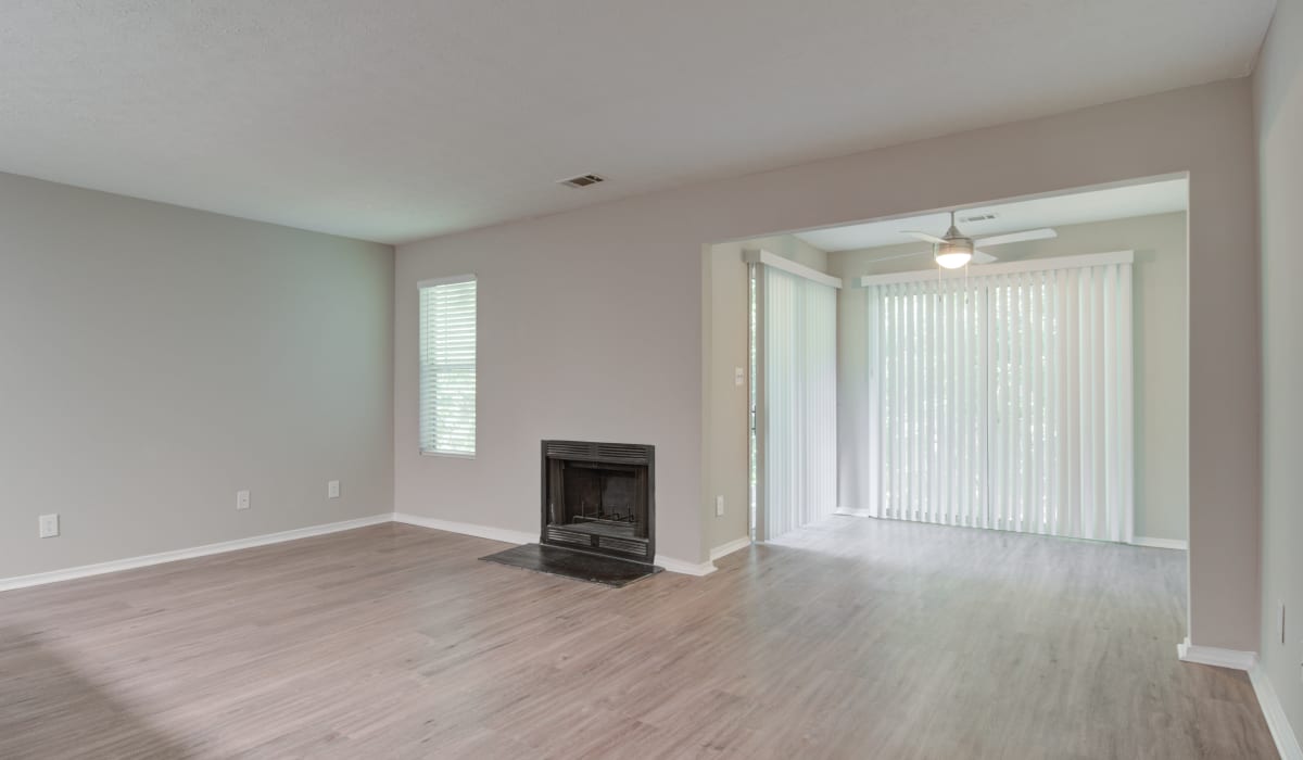 Fireplace and sliding glass door at Reserve at Garden Lake in Riverdale, Georgia