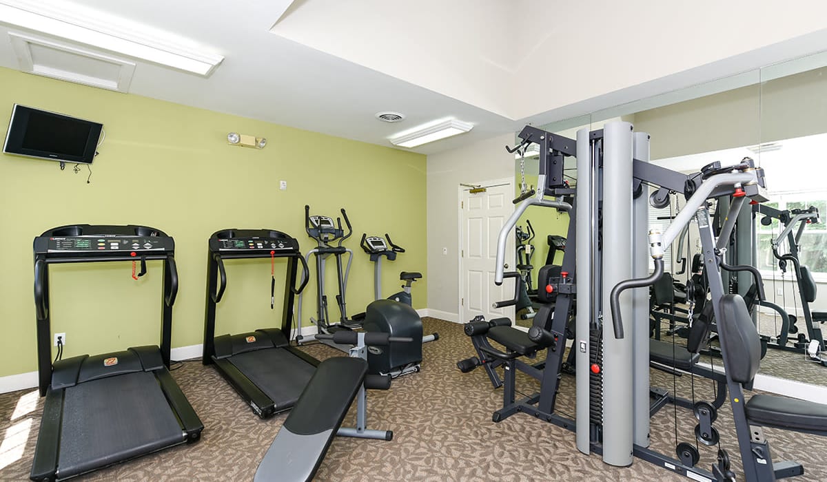 Fitness center with plenty of equipment at Encore Townhomes in Utica, Michigan