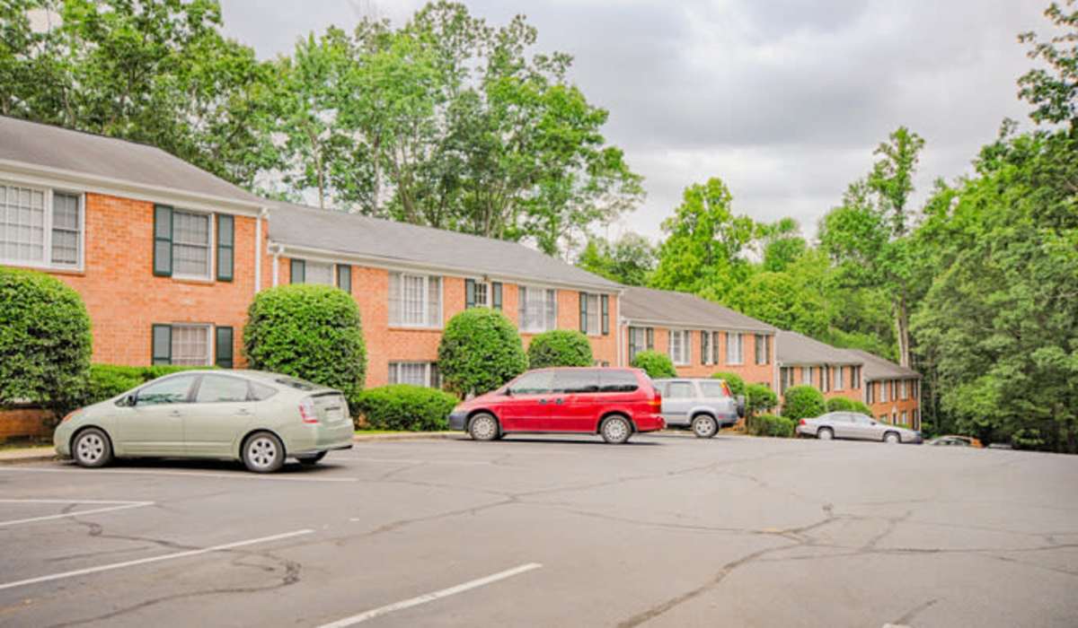 Spacious parking area for vehicles and a well-defined footpath for walking at Berkshire and Barter Court Apartments in Charlottesville, Virginia