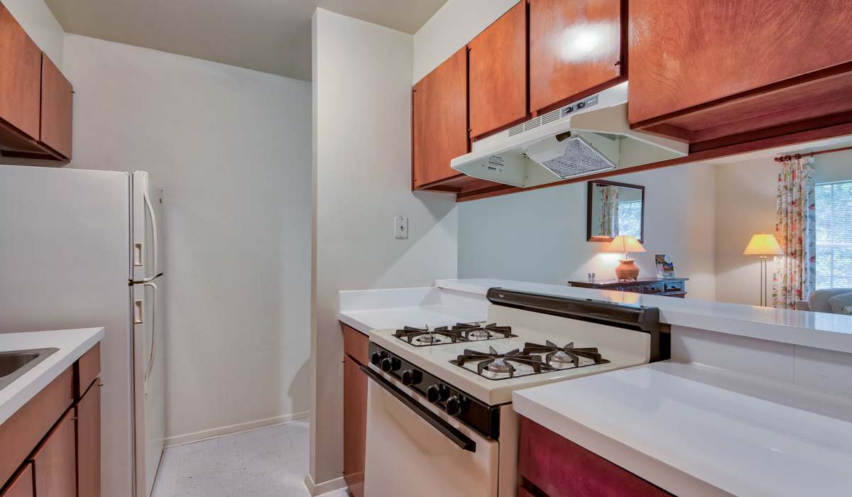Kitchen with white appliances at Willow Oaks Apartments in Richmond, Virginia