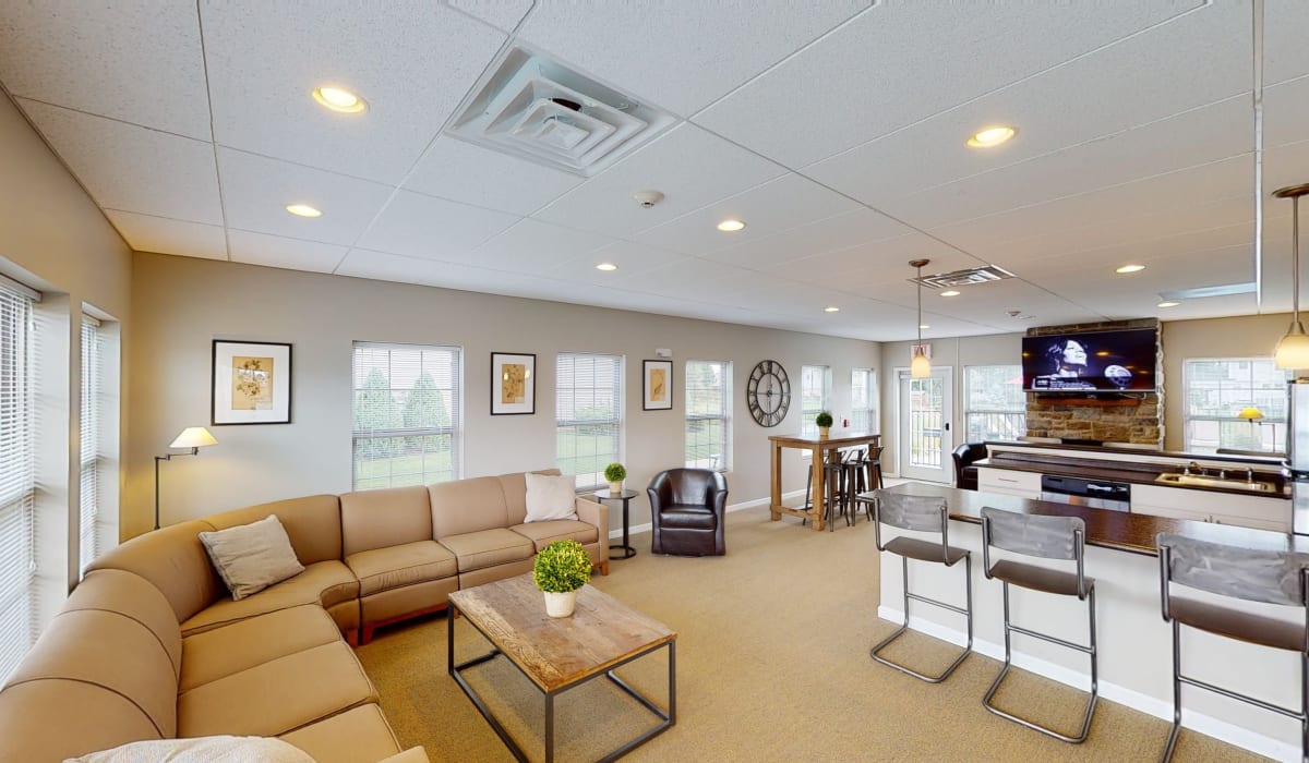 Clubhouse Lounge with TV at Park Lane South Apartments in Depew, New York