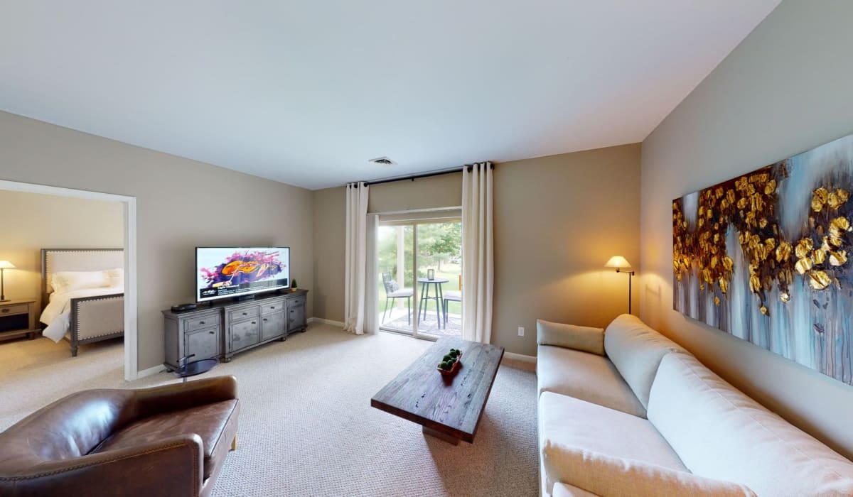 Living room and bedroom at Park Lane Apartments in Depew, New York