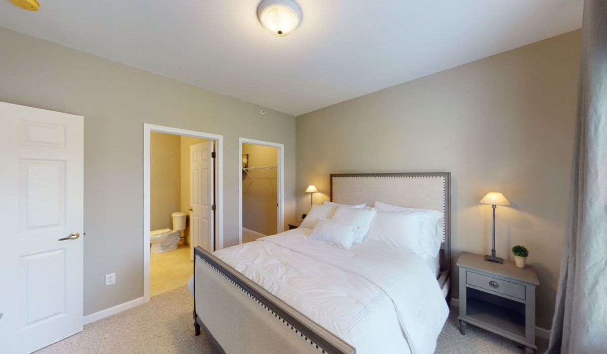 Bedroom with attached bathroom at Park Lane Apartments in Depew, New York