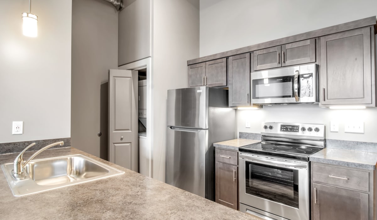 Stainless-steel appliances in a European-inspired apartment at Barcalo Living in Buffalo, New York