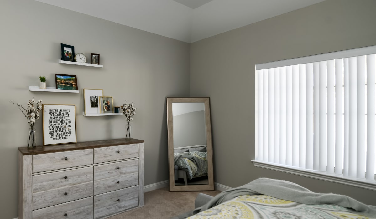 Bedroom with large windows at Encore Townhomes in Utica, Michigan