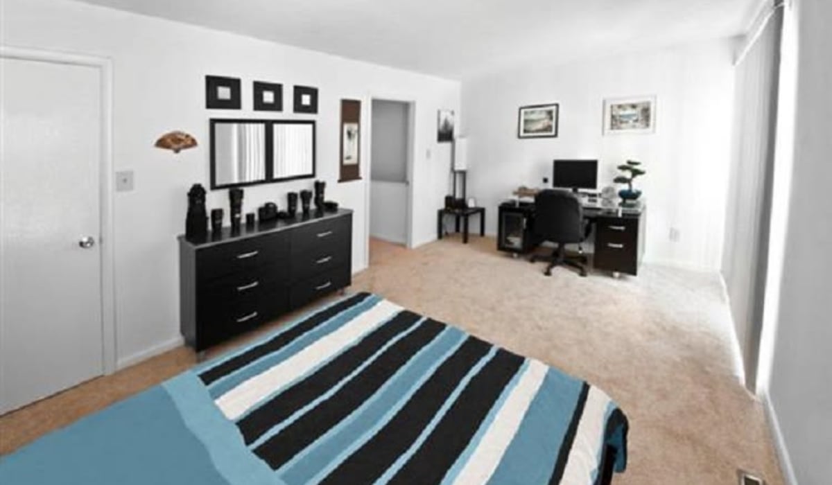 apartment bedroom with a desk in it at Towne Crest in Gaithersburg, Maryland