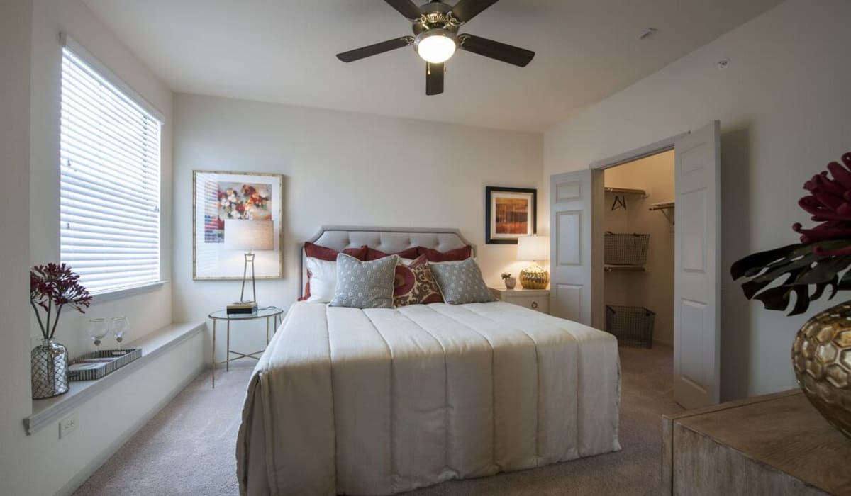 Master bedroom with a walk in closet at The Crossing at Katy Ranch in Katy, Texas