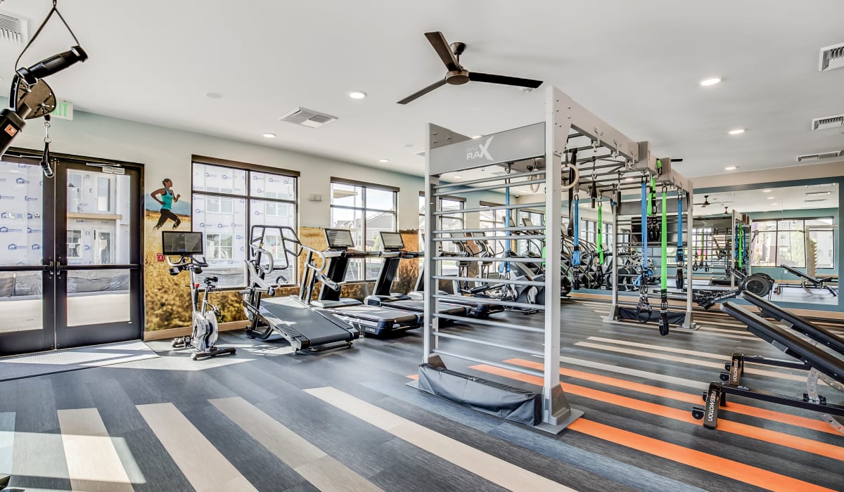 Modern fitness center with big windows at The Wright Apartments in Centennial, Colorado