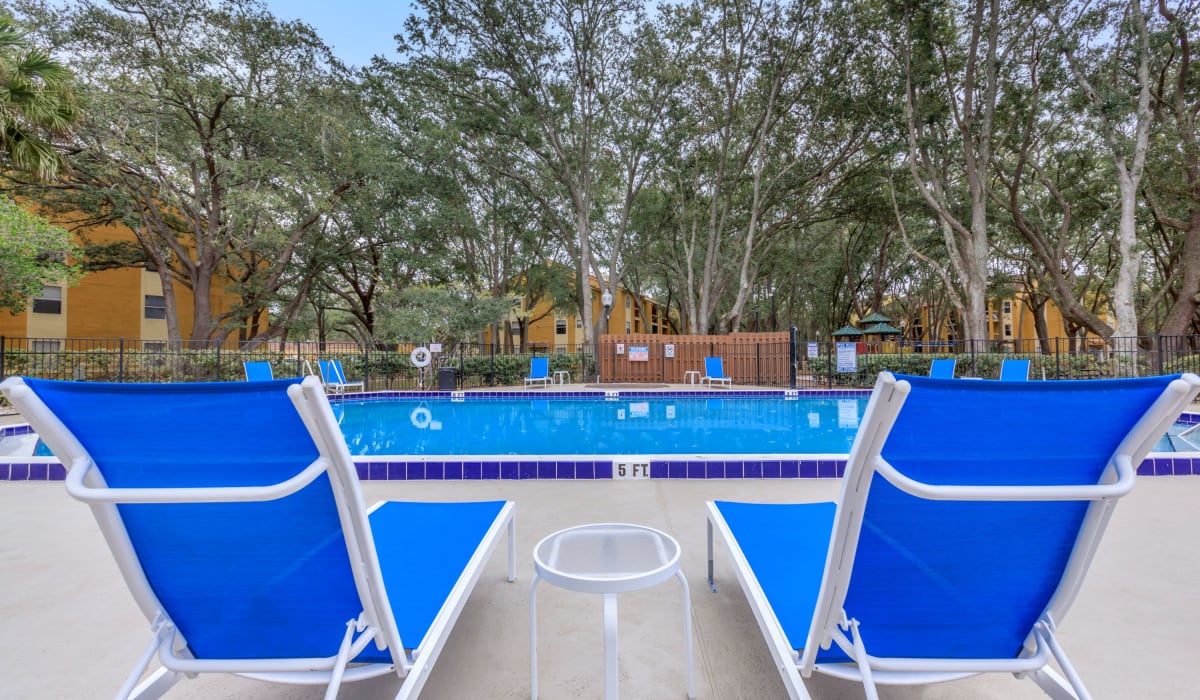 Lounge chairs by the pool at Images Condominiums in Kissimmee, Florida