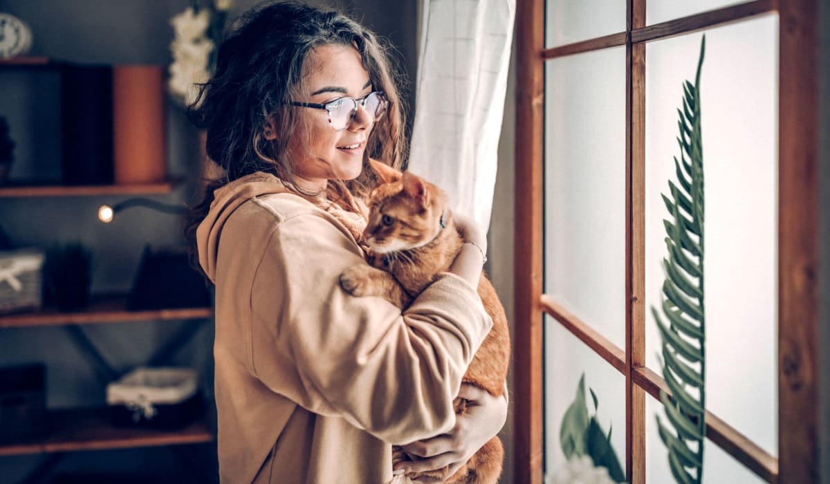 Resident holding her cat at 1408 Casitas at Palm Valley in Avondale, Arizona