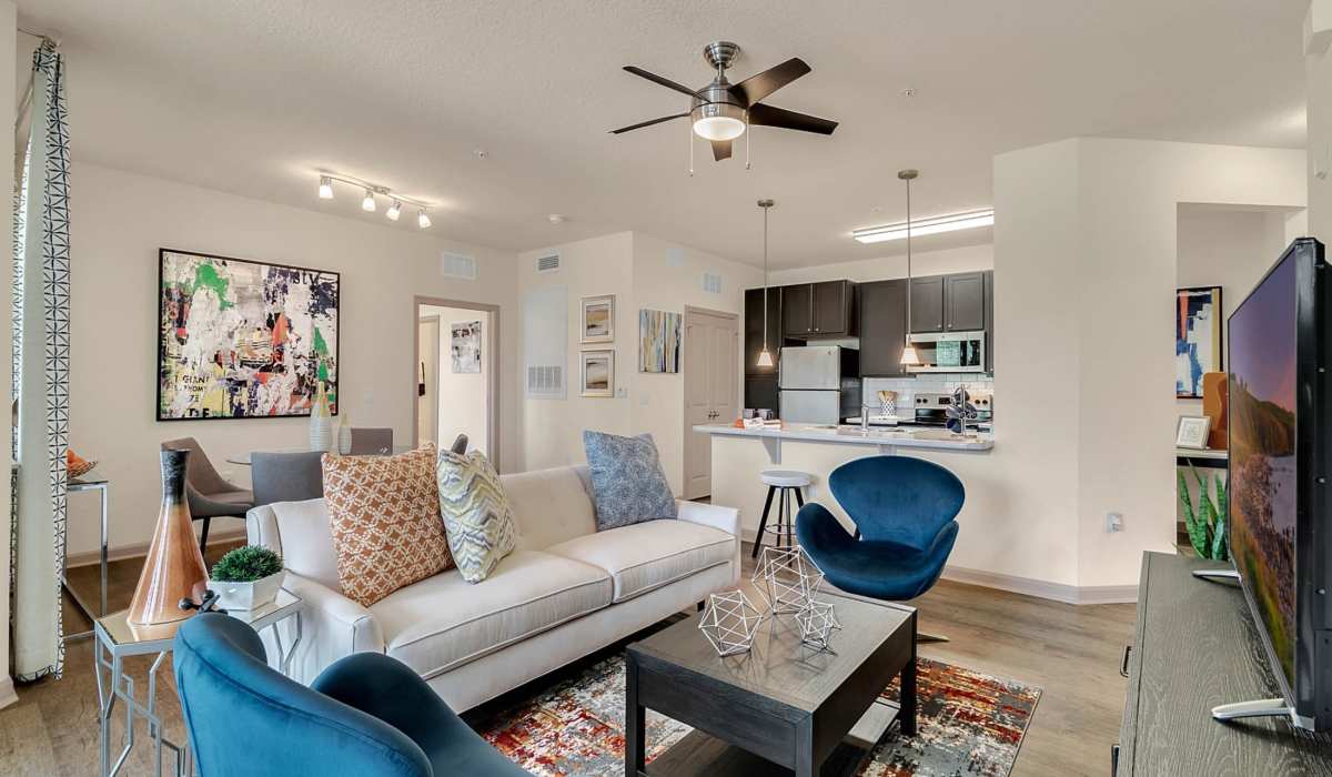 Furnished living room with ceiling fan at Art Avenue Apartment Homes in Orlando, Florida