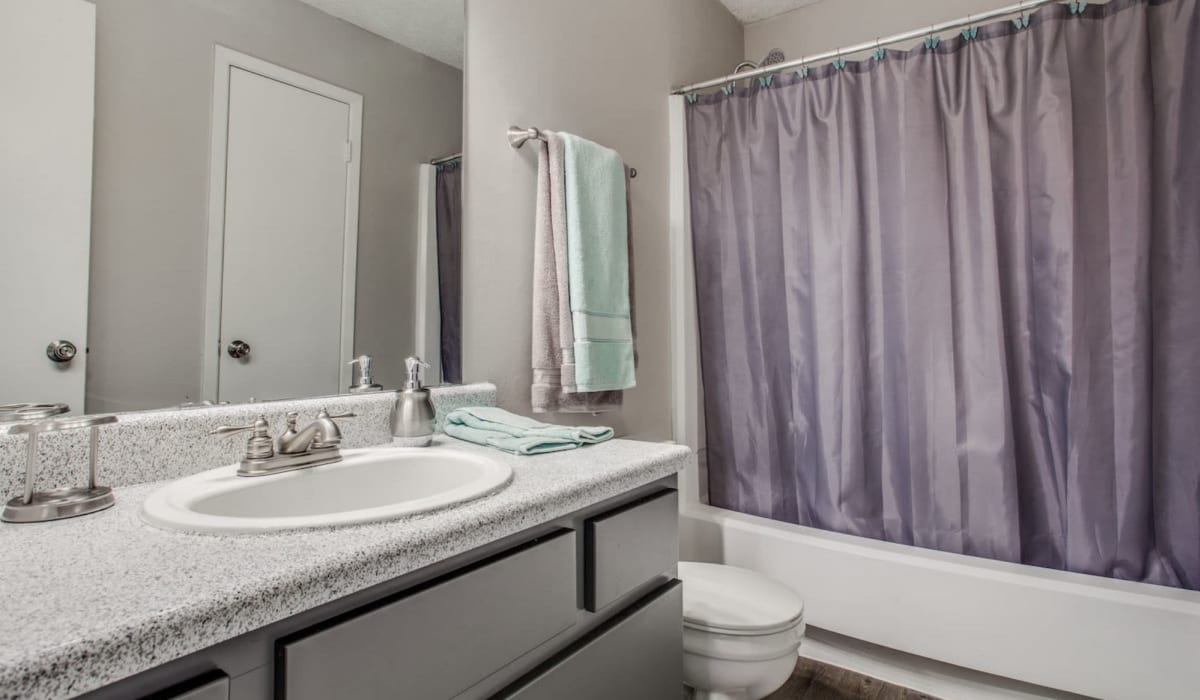 Open bathroom at Athena Apartment Homes in Benbrook, Texas