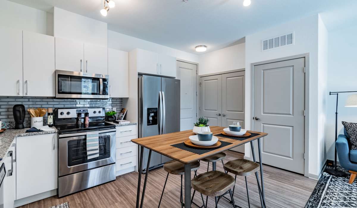 Eat-in kitchen with stainless steel appliances at Vue on Lake Monroe in Sanford, Florida