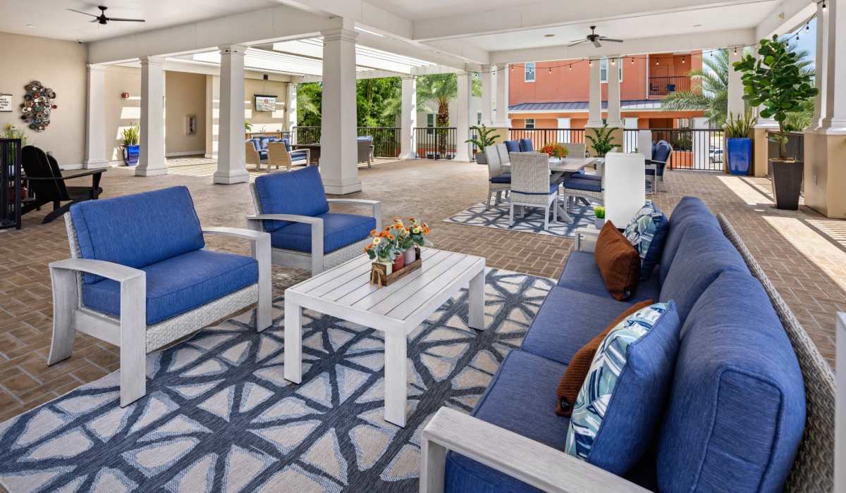 Resident covered patio lounge at Station House at Lake Mary in Lake Mary, Florida